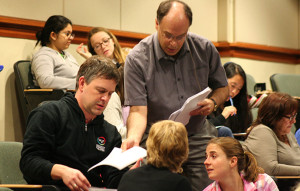 Moog passing out worksheets to faculty in November 2015 POGIL talk.