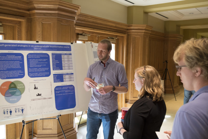 Steve Foltz discusses his poster presentation at the GSPD Reception 2018