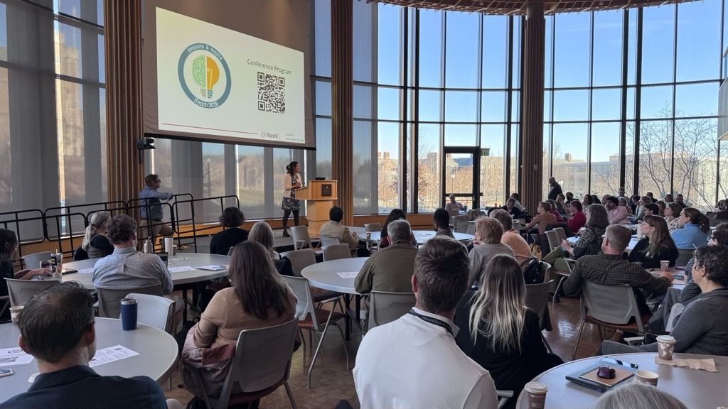Jen Smith speaks to iTeach attendees from the stage in Clark-Fox Forum