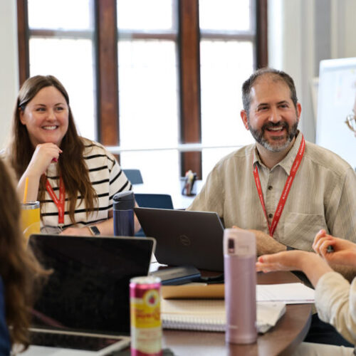 smiling people around a table
